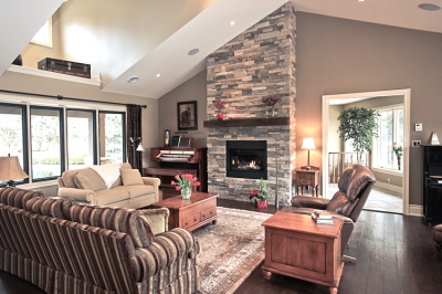 Designs by Santy :: Country Ranch Great room with fireplace, loft ceiling and dormers