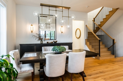 Designs by Santy :: Coastal Farmhouse Dining area with chandelier and staircase