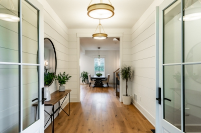 Designs by Santy :: Coastal Farmhouse Grand entry to foyer with double doors and chandeliers