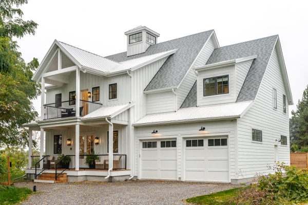 Designs by Santy :: Coastal Farmhouse Front exterior with lighthouse tower, board and batten, metal roof, porch and balcony