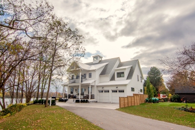 Designs by Santy :: Coastal Farmhouse Front exterior with lighthouse tower, board and batten, and metal roof