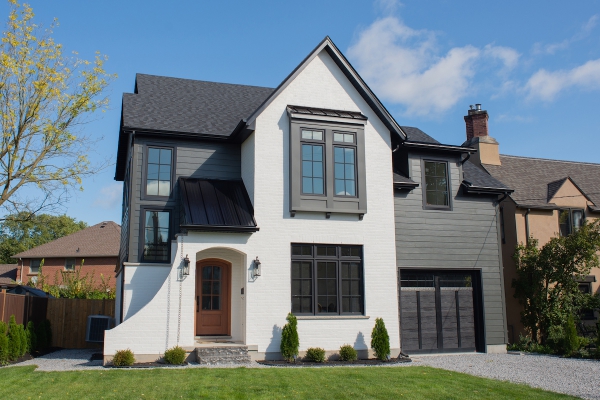 Designs by Santy :: Black and White House Front exterior with white brick, siding and metal roof