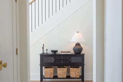 Designs by Santy :: Black and White House Mudroom with arched entry and checker tile