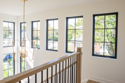 Designs by Santy :: Black and White House Second floor landing with chandelier and window grills