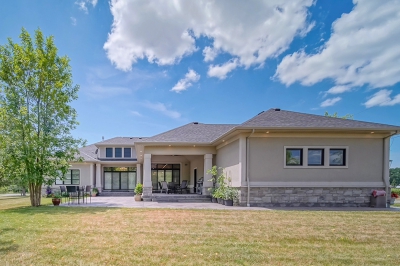 Designs by Santy :: Rural Symmetry Rear exterior with stucco and outdoor living space