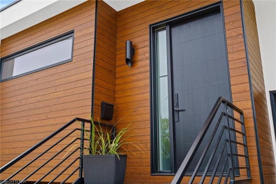 Designs by Santy :: Post House Modern front entry with wood siding and sidelight