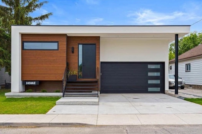 Designs by Santy :: Post House Modern front exterior with stucco and wood siding