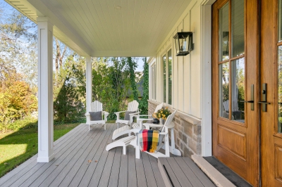 Designs by Santy :: Hilltop Farmhouse Front deck with board and batten and square posts