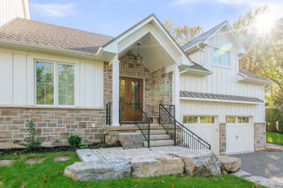 Designs by Santy :: Hilltop Farmhouse Front exterior with stone and board and batten