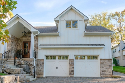 Designs by Santy :: Hilltop Farmhouse Two car garage with board and batten and stone