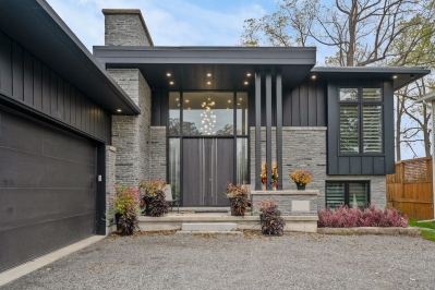 Designs by Santy :: Elevated Bungalow Front entry with flat roof, stone and vertical siding