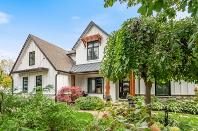 Designs by Santy :: Upscale Craftsman Transformation Craftsman exterior with board and batten, metal roof, stone, and wood accents