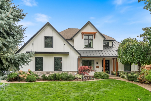 Designs by Santy :: Upscale Craftsman Transformation Craftsman exterior with board and batten, metal roof, stone, and wood accents