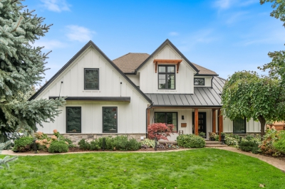 Designs by Santy :: Upscale Craftsman Transformation Craftsman exterior with board and batten, metal roof, stone, and wood accents