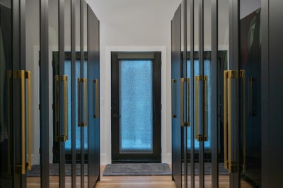 Designs by Santy :: Modern Luxury Contemporary walk-in closet with brass hardware