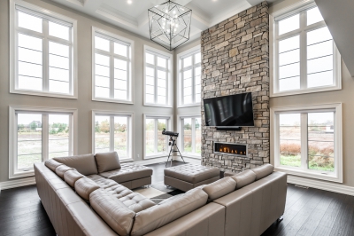 Designs by Santy :: Grand Estate Great room with, two-story windows, stone fireplace and coffered ceiling