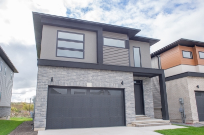 Designs by Santy :: Outline Houses Contemporary front elevation with stucco, wood siding and brick