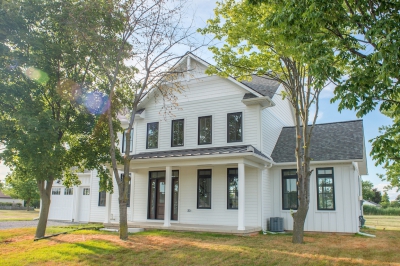 Designs by Santy :: Modern Farmhouse Front exterior with metal roof, board and batten and window grills