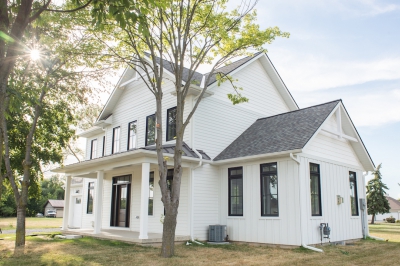 Designs by Santy :: Modern Farmhouse Front exterior with metal roof, board and batten and window grills