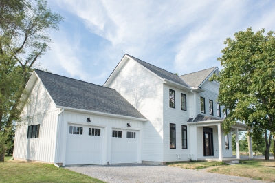 Designs by Santy :: Modern Farmhouse Front exterior with metal roof, board and batten and window grills