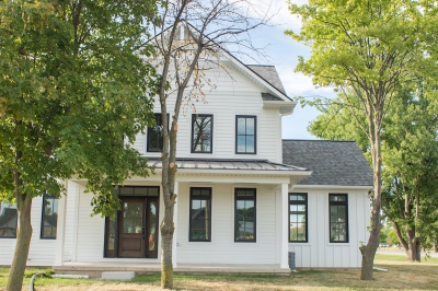 Designs by Santy :: Modern Farmhouse Front exterior with metal roof, board and batten and window grills