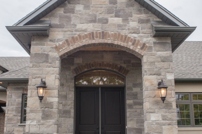 Designs by Santy :: Grand Reno Front porch with stone and arched entry